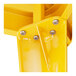 A close up of a yellow metal Lancaster Table & Seating table structure.
