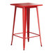 A Lancaster Table & Seating red metal bar table with a square top.
