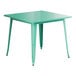 A green Lancaster Table & Seating outdoor table with metal legs.