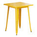 A Lancaster Table & Seating yellow metal table with legs.