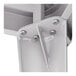 A close-up of a metal bracket with screws from a Lancaster Table & Seating Alloy Series outdoor table.