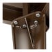 A close-up of the metal structure of a Lancaster Table & Seating outdoor table.