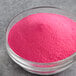 A bowl of Great Western Pink Strawberry Cotton Candy concentrate sugar.