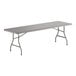 A large rectangular gray folding table with gray metal legs.