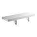 A white shelf with aluminum brackets folded up.