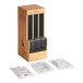 A wooden box with World Centric Touchless Cutlery Dispenser sleeves.