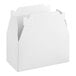 A white cardboard Southern Champion take-out box with a handle.
