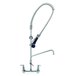 A T&S chrome wall mounted pre-rinse faucet with a flexible hose.