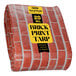 A roll of black tarp with a brick pattern.