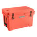 A coral CaterGator outdoor cooler with black handles.