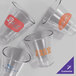 An Acopa Endure Tritan plastic stackable rocks glass with orange text on a white background.