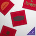 A red square with a green logo.
