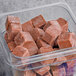 A plastic container of brown Live Pure Acai Blend smoothie cubes.