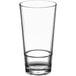 An Acopa Endure stackable cooler glass with a clear rim on a white background.