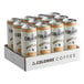 A close up of a white and orange La Colombe Caramel Draft Latte can.
