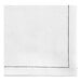 A white cloth napkin with black dots.