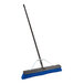 A blue Lavex push broom with a long metal handle.