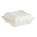 A white Fabri-Kal Greenware 3-compartment hinged container.