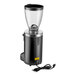 A black Mahlkonig Grind-by-Sync espresso grinder with a cord attached.