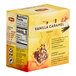 A yellow box of Lipton Vanilla Caramel Black Pyramid Tea Bags with text and images on it.