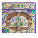 A white Southern Champion Bakery box with Mardi Gras king cake cutout designs.