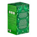 A green box of Pukka Organic Supreme Matcha Green Tea Bags with leaves and text on it.