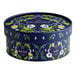A round blue Pukka Organic Workday Wellness Tea variety pack with flowers and leaves on it.