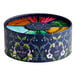 A round box of Pukka Organic Workday Wellness Tea with colorful tea bags inside.