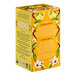 A yellow box of Pukka Organic Lemon, Ginger, and Manuka Honey tea bags with white text and yellow flowers.