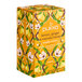 A yellow box of Pukka Organic Lemon, Ginger, and Manuka Honey Herbal Tea Bags on a table.