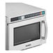 A Solwave stainless steel commercial microwave with a door open.