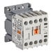 A grey and white Noble Warewashing contactor with an orange button.