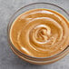 A bowl of Producers Peanut Company Natural Creamy Peanut Butter.