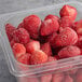 A plastic container of Wyman's strawberries.