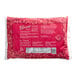 A white bag of Wyman's frozen red raspberries with a pattern of raspberries.