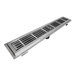 A stainless steel floor trough with anti-slip subway grating over a drain outlet.