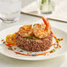 A plate of food with shrimp and rice.