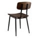 A brown wooden Lancaster Table & Seating chair with black legs and backrest.