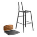 A Lancaster Table & Seating black bar stool with a black vinyl seat and wood backrest.