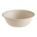 A World Centric compostable fiber take-out bowl with a white surface.