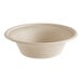 A World Centric compostable fiber bowl with a white surface.