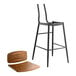 A Lancaster Table & Seating black barstool with a vintage wooden seat and backrest.