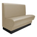 A tan booth with a black base.