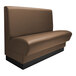 A brown leather booth with black base.
