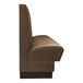 A brown leather booth with black base.