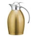 A gold and stainless steel Service Ideas Nicollet coffee carafe with a push button lid.