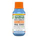 A TheraBreath blue bottle with white label and orange cap.