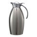A stainless steel Service Ideas Nicollet coffee carafe with a handle.
