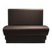 A brown leather booth with black legs.