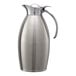 A stainless steel Service Ideas Nicollet carafe with a handle.